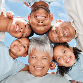 Shot of a multi-generational family standing together in a huddle